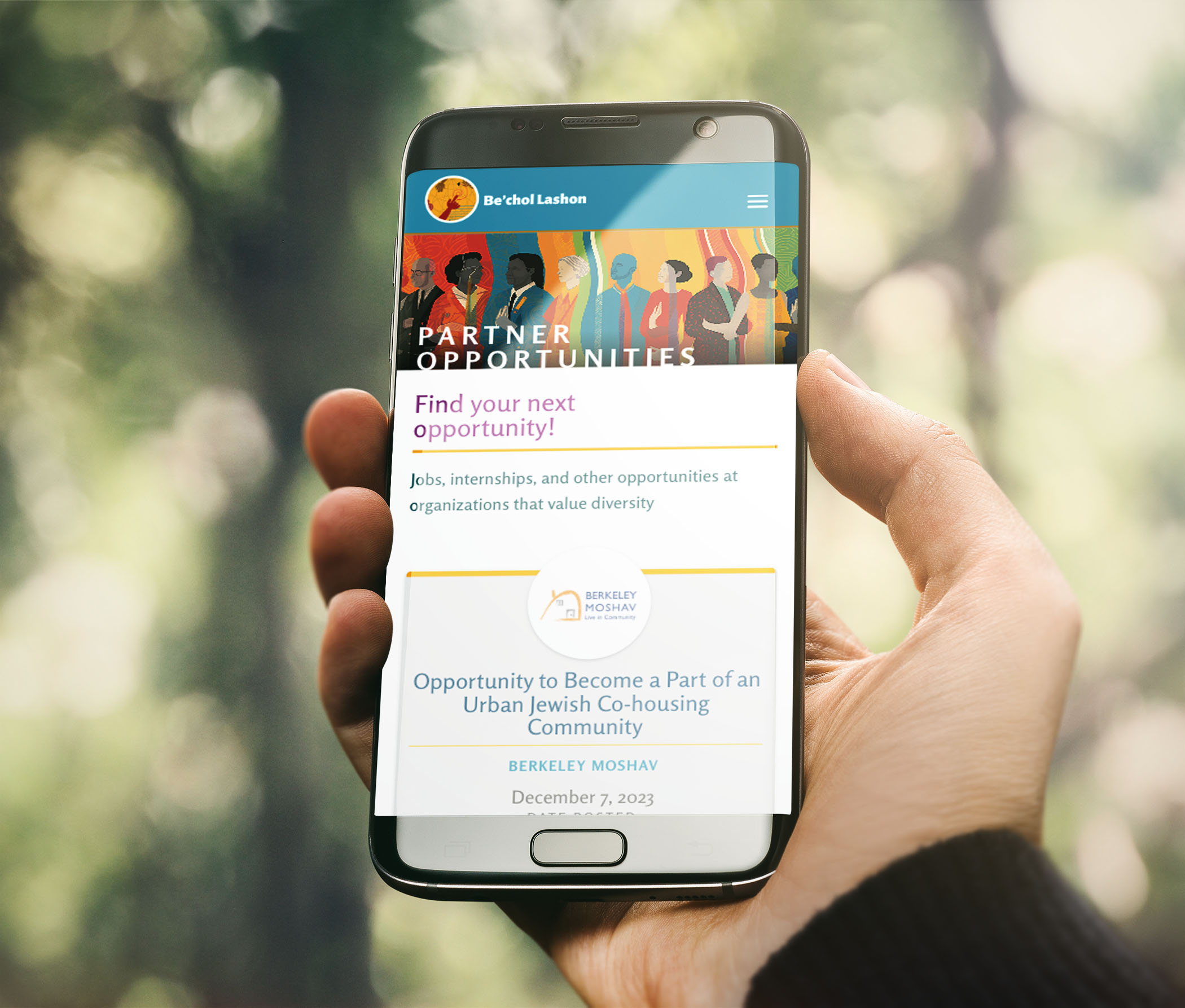 A phone displaying the webiste design on one of Bechol Lashon's web pages. It includes the colors and fonts that make their brand identity.